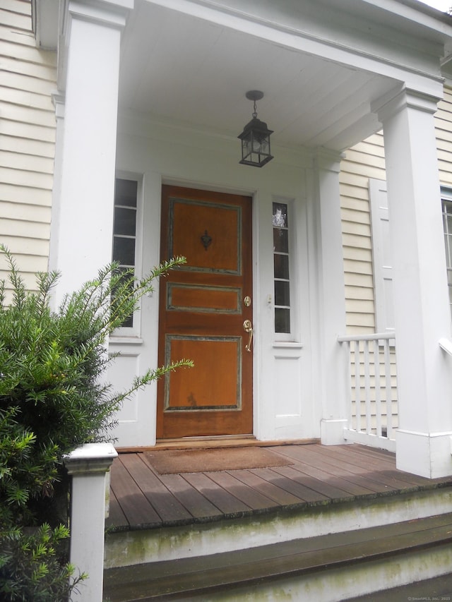 view of exterior entry with covered porch