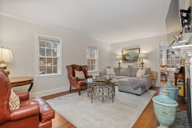 living room with hardwood / wood-style flooring and ornamental molding