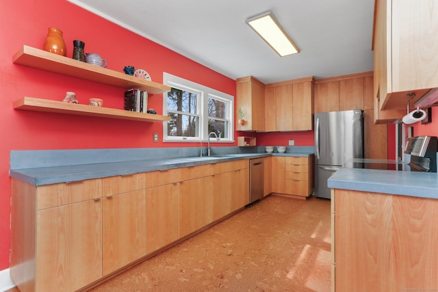 kitchen featuring open shelves, appliances with stainless steel finishes, modern cabinets, and a sink