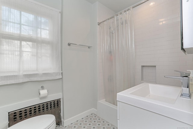 full bathroom featuring toilet, a sink, baseboards, radiator, and shower / bathtub combination with curtain