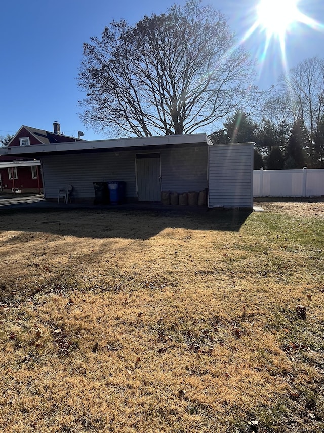 back of house with a yard