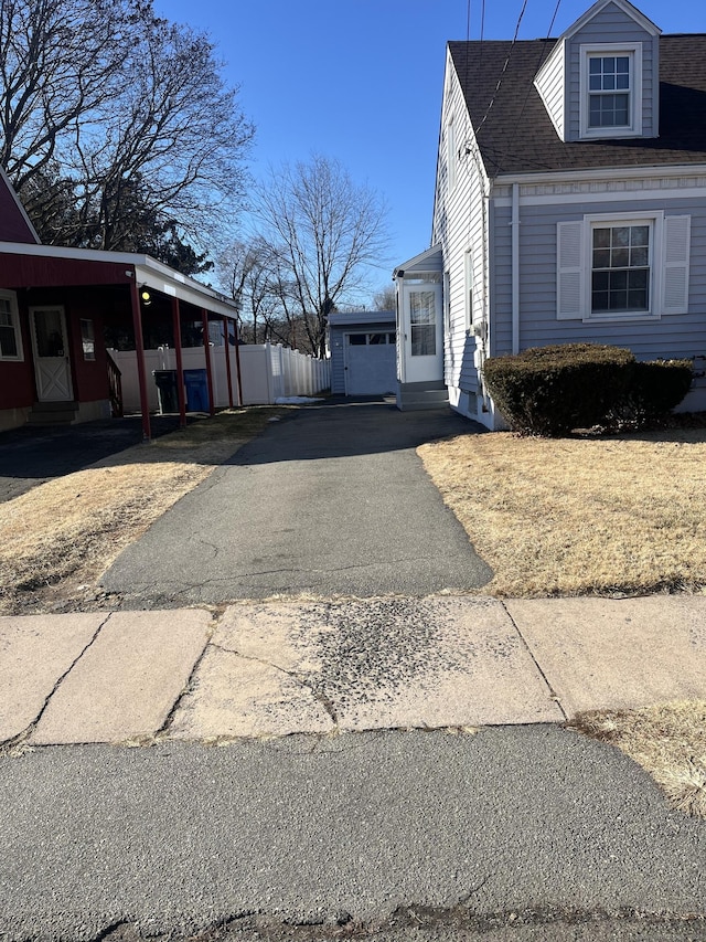 view of property exterior with a carport