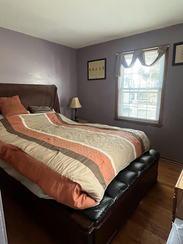 bedroom featuring dark wood-type flooring