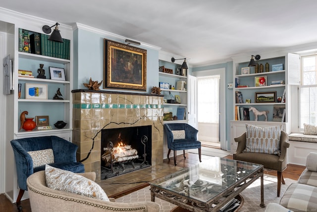 4 Main St, Salisbury, CT 06068 - living area with ornamental molding, healthy amount of natural light, a high end fireplace, wood finished floors, and built in features