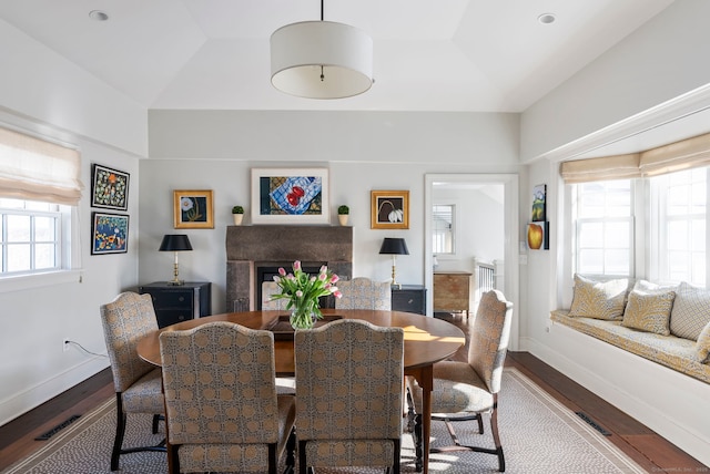 4 Main St, Salisbury, CT 06068 - dining area featuring wood finished floors, lofted ceiling, and a fireplace