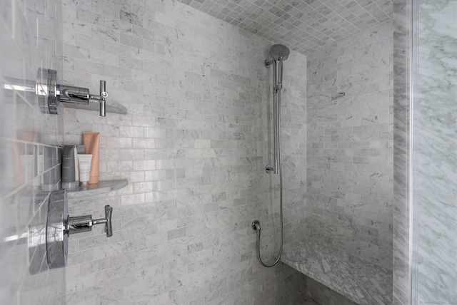 bathroom with tiled shower