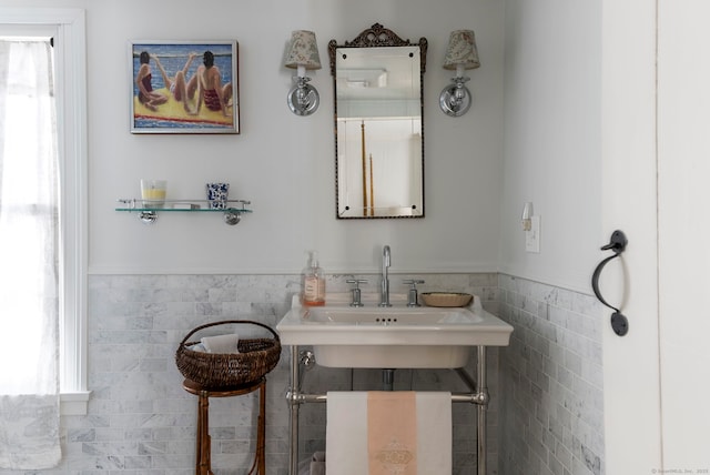 bathroom featuring tile walls and plenty of natural light