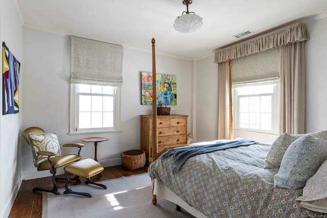 bedroom featuring hardwood / wood-style flooring and ornamental molding