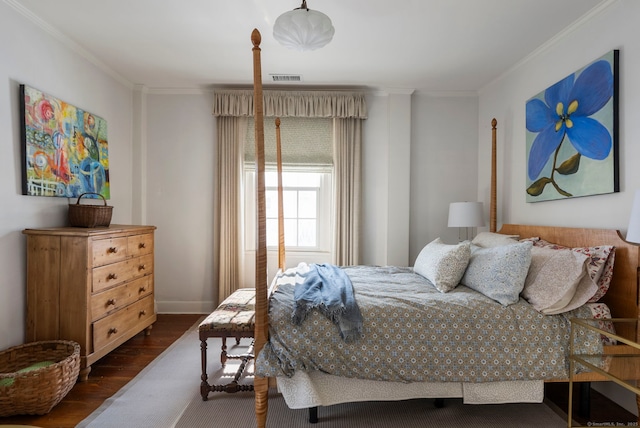 bedroom featuring ornamental molding and dark hardwood / wood-style flooring