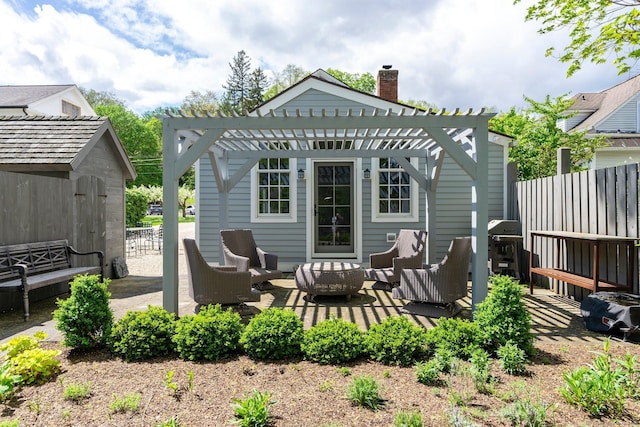 4 Main St, Salisbury, CT 06068 - back of property with an outdoor living space, a pergola, a patio, a storage unit, and a chimney