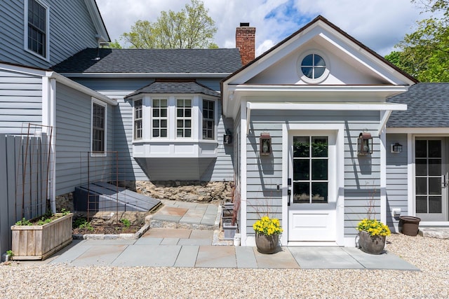 4 Main St, Salisbury, CT 06068 - doorway to property with a chimney and a shingled roof