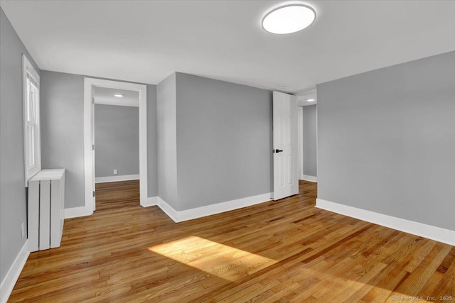 unfurnished room featuring light hardwood / wood-style floors