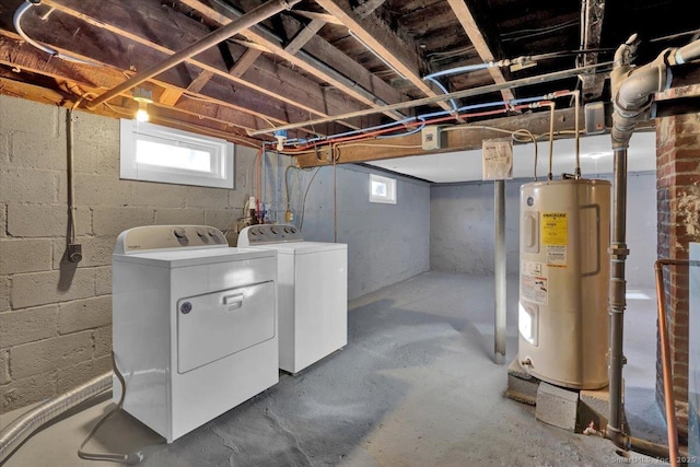 basement featuring washer and dryer and water heater