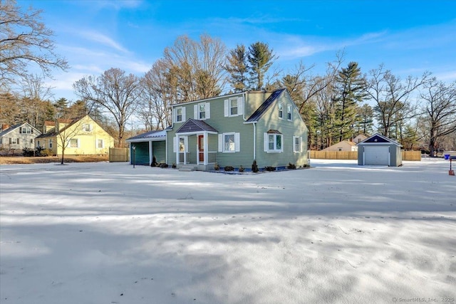 view of front of house featuring a garage and an outdoor structure