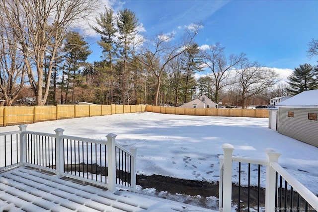 view of yard covered in snow