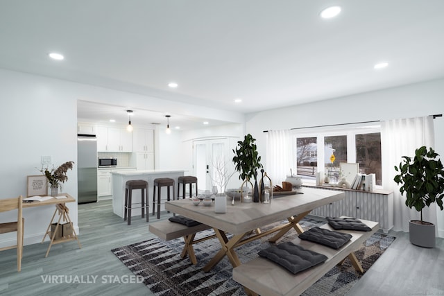 dining room featuring light hardwood / wood-style flooring