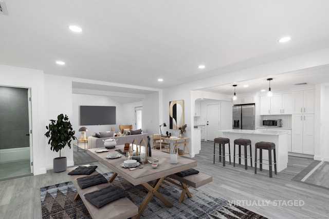 dining area with light wood-type flooring