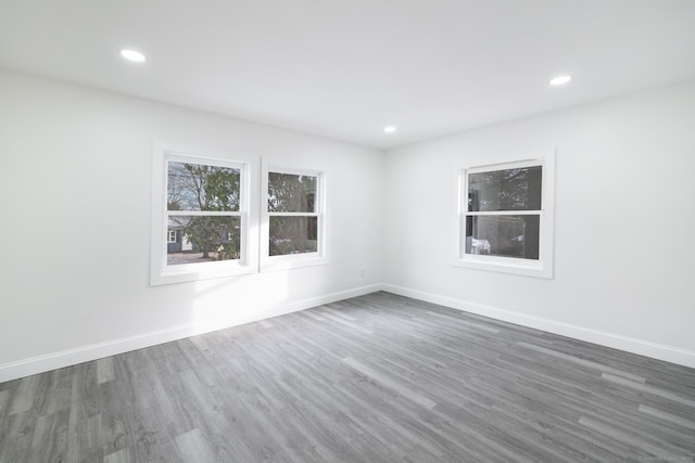 empty room with dark hardwood / wood-style flooring