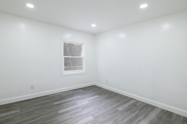 spare room featuring dark hardwood / wood-style flooring