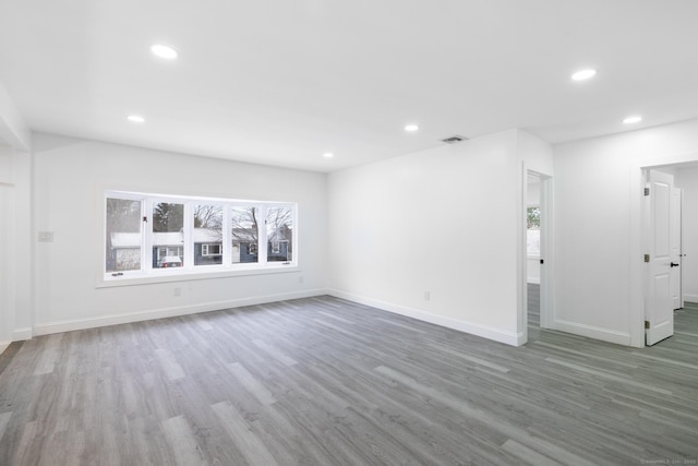 unfurnished living room with hardwood / wood-style flooring