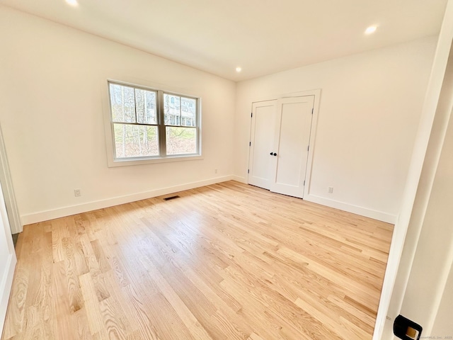 unfurnished bedroom with light hardwood / wood-style floors