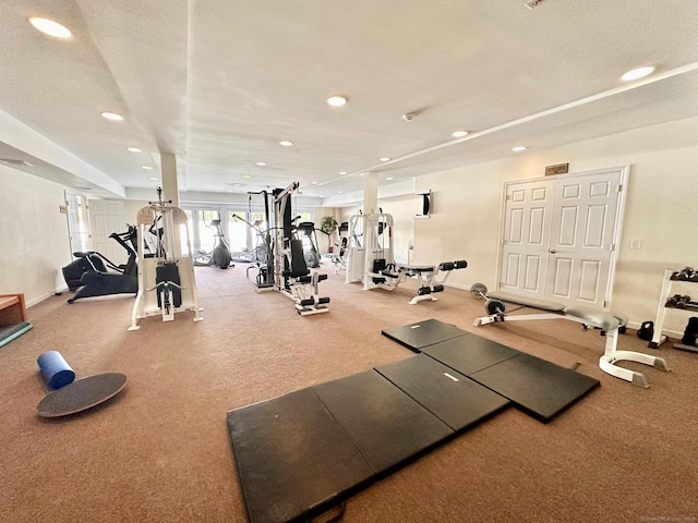 workout area with a textured ceiling