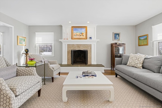 living room featuring a high end fireplace