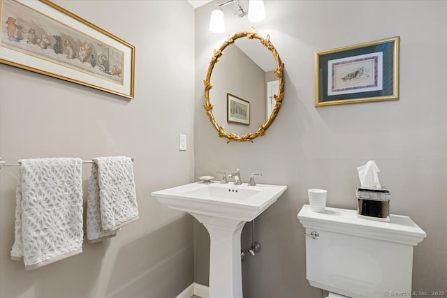 bathroom featuring sink and toilet