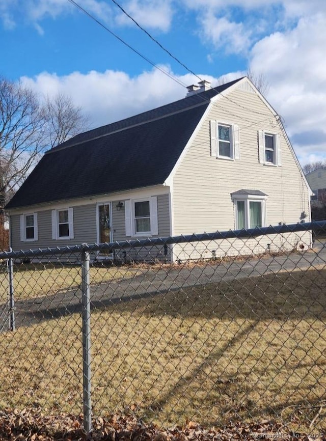 view of home's exterior with a yard