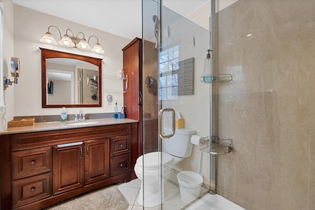 bathroom with walk in shower, tile patterned floors, vanity, and toilet