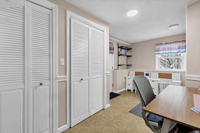 office area with radiator and a textured ceiling