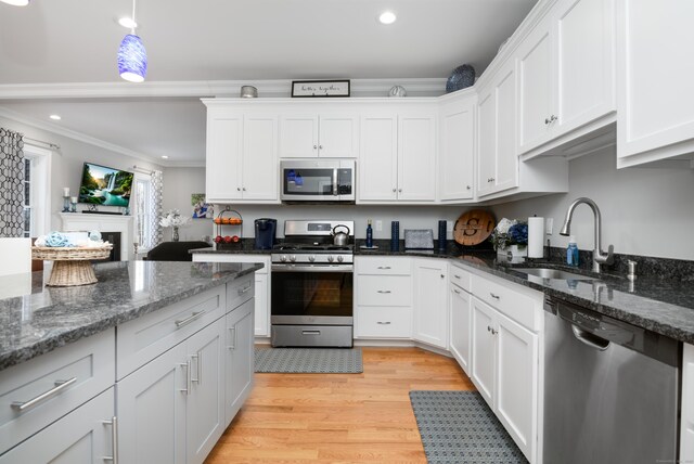 kitchen featuring white cabinetry, sink, and appliances with stainless steel finishes