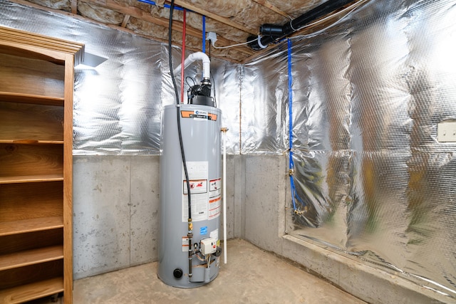 utility room featuring water heater