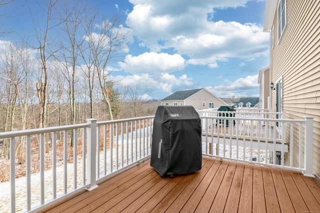 wooden deck with grilling area