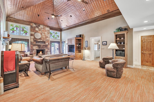 24 Brierwood Dr, Orange, CT 06477 - living room featuring high vaulted ceiling, a fireplace, healthy amount of natural light, light carpet, and baseboards