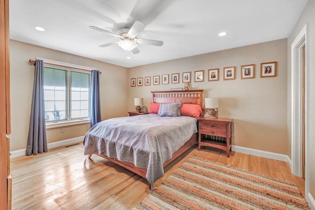 bedroom with ceiling fan and light wood-type flooring