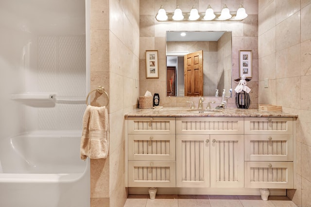 24 Brierwood Dr, Orange, CT 06477 - bathroom with tile walls, vanity, a tub, and tile patterned flooring