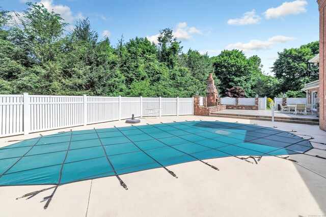 24 Brierwood Dr, Orange, CT 06477 - view of pool featuring a patio area and fence