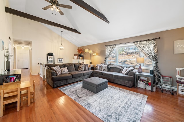 living room featuring ceiling fan, wood-type flooring, beam ceiling, and high vaulted ceiling