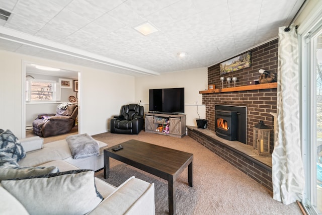 living room featuring a wealth of natural light and carpet flooring