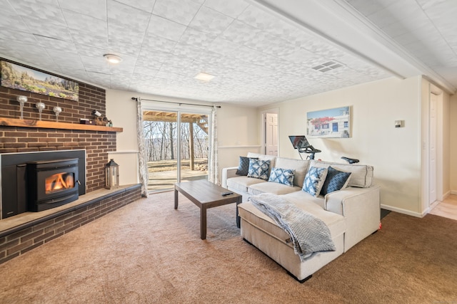 living room featuring carpet flooring and a fireplace