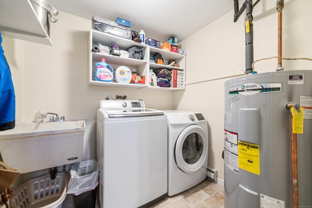 washroom with washer and dryer, electric water heater, and sink