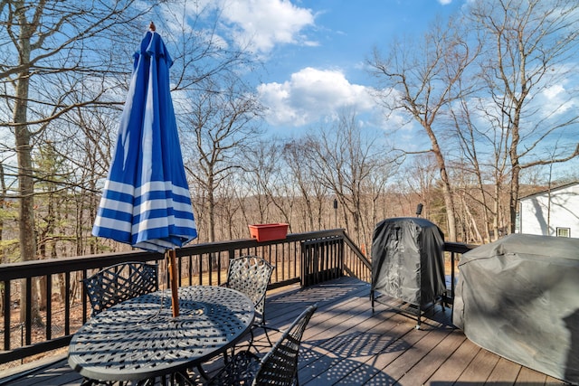 wooden deck featuring grilling area