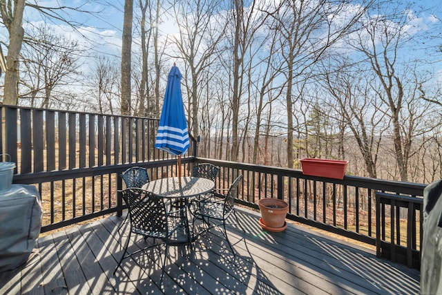 wooden deck with a grill