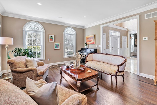 living room with visible vents, crown molding, baseboards, and dark wood-style flooring