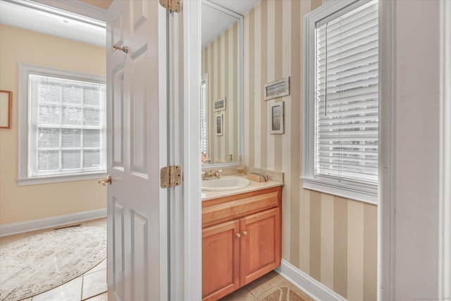 bathroom with visible vents, wallpapered walls, tile patterned flooring, baseboards, and vanity