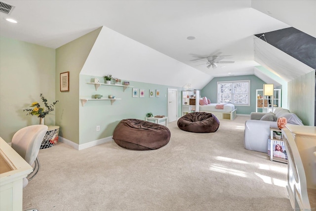 interior space featuring visible vents, carpet floors, baseboards, ceiling fan, and vaulted ceiling