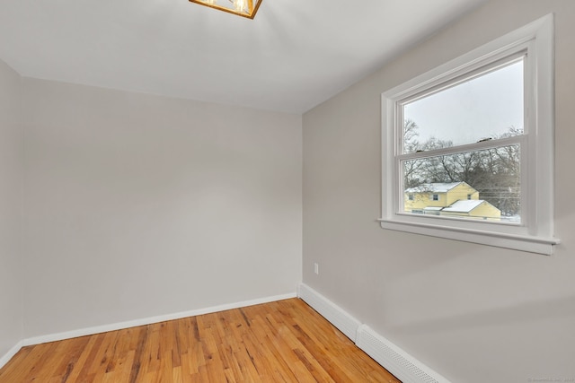 spare room with light wood-type flooring