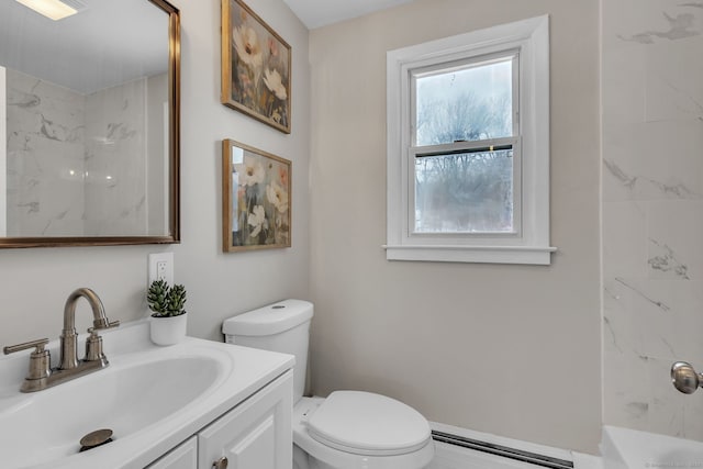 bathroom featuring vanity, a baseboard heating unit, and toilet