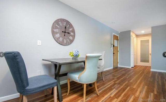 dining area featuring wood-type flooring